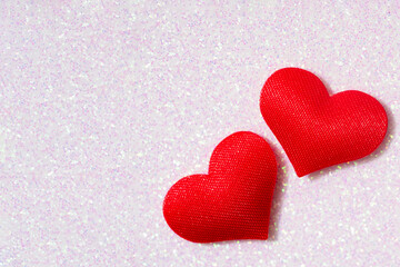 Fototapeta premium Red hearts over shiny background with copy space for text. Love symbol. St. Valentine's Day celebration concept. Template for greeting or wedding card