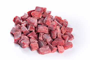 Frozen meat cubes isolated on white background