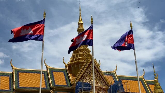 National flags of Cambodia are seen in front of the Royal Palace complex, home to Cambodian kings in Phnom Penh city, Cambodia.