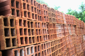 Pile of hollow bricks for constructing a building