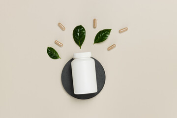 Medical vitamin bottle with herbal pills and leaves top view, bio supplement