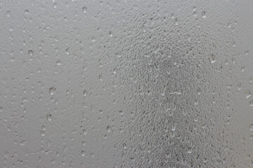 Water drops on frosted glass