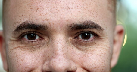 Contemplative young man closing eyes, taking a deep breath, feeling relaxed. close-up eyes portrait face