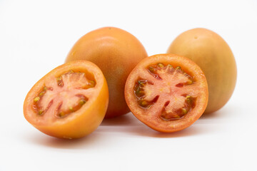 fresh organic tomatoes isolated on white background.