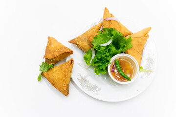 deep fry Samosa with chili and onion isolated on white background,