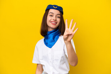 Airplane stewardess Ukrainian woman isolated on yellow background happy and counting four with fingers