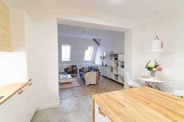 Fototapeta na wymiar Modern apartment kitchen with a counter and three bar stools
