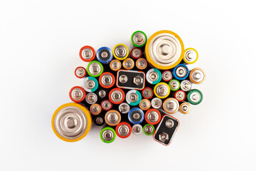 Composition with alkaline batteries on white background. Chemical waste. Top view.