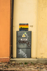 old street in the city and electric box in the wall