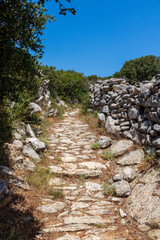 Old path and ancient wall at Melanes traditional village in Naxos. Greece.