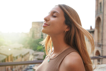 Profile of woman breathe relaxed with closed eyes on sunset. Beauty sunshine girl side portrait....