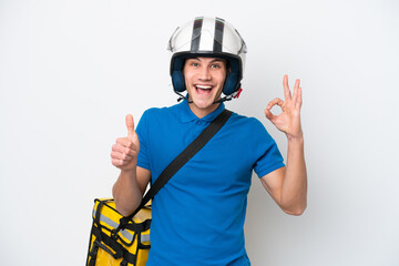 Young caucasian man with thermal backpack isolated on white background showing ok sign and thumb up gesture