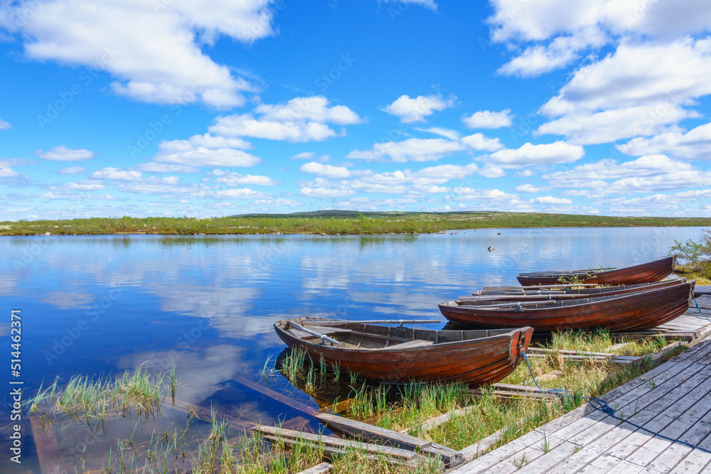 Poster Rowing boats at a lake in a the highlands in the north