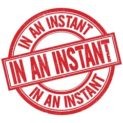 IN AN INSTANT written word on red stamp sign