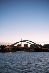 Fototapeta na wymiar city harbour bridge at sunset