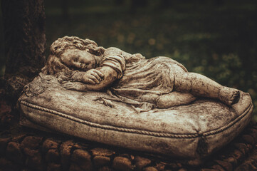 sculpture of a sleeping child