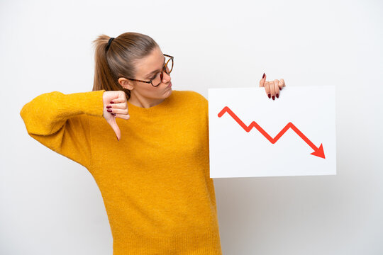Young caucasian woman isolated on white background holding a sign with a decreasing statistics arrow symbol and doing bad signal