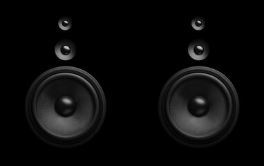 Pair of black speakers close-up. Bass and tweeter in one speaker.