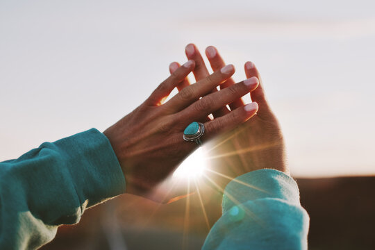 Cropped Image Of Hand Against Sunset