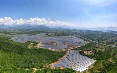 Fototapeta na wymiar KHANH HOA, VIETNAM, June 14, 2022. Panorama of Van Ninh solar power plant in Van Ninh district, Khanh Hoa province, Vietnam. A factory with a capacity of 100 MWp with an area of 120 hectares.