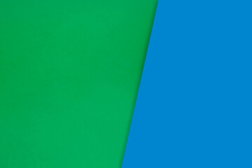 Dark vs light abstract Background with plain subtle smooth de saturated blue green colours parted into two	