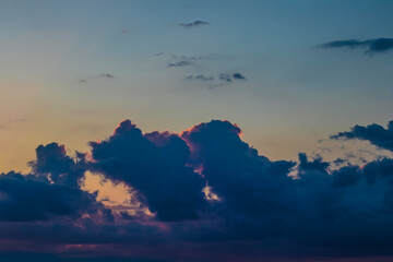 Colorful high contrast clouds during evening sunset with copy space