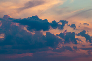 Colorful high contrast clouds during evening sunset with copy space