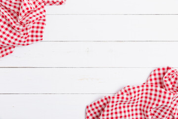 Flat lay cotton with copy space for text menu to restaurants. Top view of fabric tablecloth red and white on wooden white table.