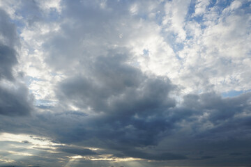Obraz premium Nimbostratus clouds are dark, grey, featureless layers of cloud, thick enough to block out the Sun and produce persistent rain.