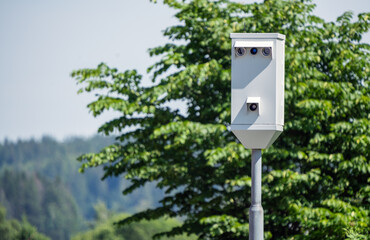 Traffic enforcement camera, speeding camera. To simulate the many road accidents happening during summertime. Police and safety concept.