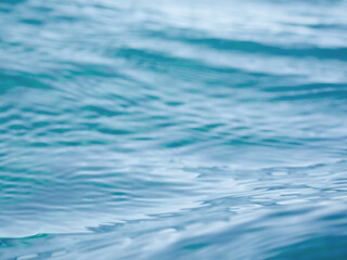 A low angle view of the Pacific ocean blue water in Maui Hawaii for a travel or swimming background with copy space