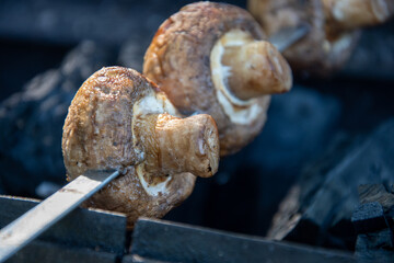 Fried juicy mushrooms on the grill summer picnic
