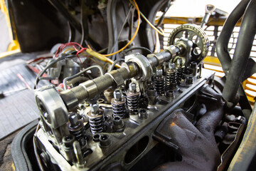 Mercedes diesel engine repair. Hands with a mechanic repairing Mercedes parts. The gas distribution mechanism of the car.