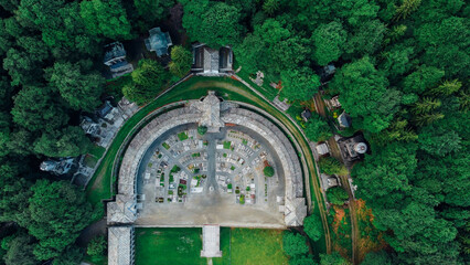 Aerial high angle view of The Monumental Cemetery of Oropa, graveyard built for noble families of the Biellese territory in Northern Italy. Semicircular architecture plan.
