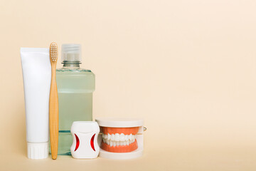 Mouthwash and other oral hygiene products on colored table top view with copy space. Flat lay. Dental hygiene. Oral care kit. Dentist concept