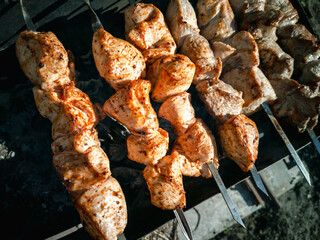 Meat skewers on skewers. Cooking on charcoal grill.