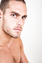 Obraz premium Naked Concern. A confident stance from a trim and muscular young male model. From a series of images with the same model.