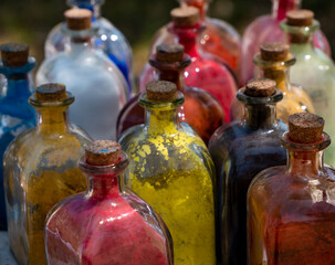 glass bottles with cork stopper with powder colors inside