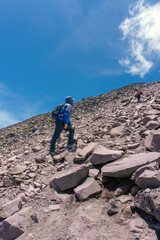 a man climbing a mountain in mexico