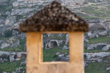 View on cave houses in Matera, seen through a chimney, Sassi di Matera in Southern Italy