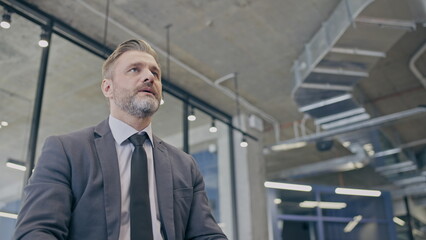 Anxious businessman having panic attack, waiting for partners in office, important deal