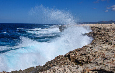 Big waves break on the rocky shore on the mediterranean sea.Cyprus