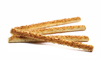 Pretzel bread sticks with sesame seeds, snacks isolated on white  