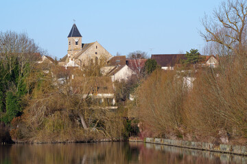 The church of the village of Vert le Petit seen from the ponds