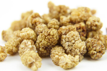 Dried mulberry on white background. Dry sweet berries morus alba