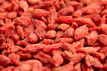 Dried goji berries red background