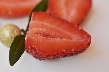 red strawberry on a heart-shaped cake. Valentine's Day.