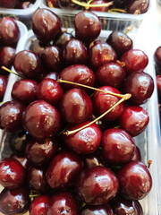 fresh ripe  organic cherries in plastic box