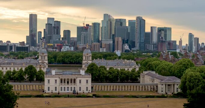 4k time lapse movie of Canary Wharf skyline, Greenwich Maritime Institute university campus and river Thames in London, UK concept for banking district, corporate headquarters and education center