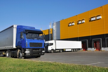 Modern logistics complex. Unloading trucks in a modern warehouse.